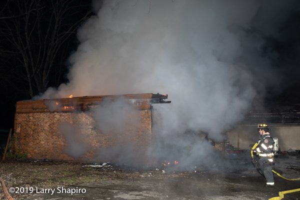 house destroyed by fire at night