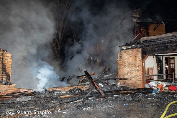house destroyed by fire at night
