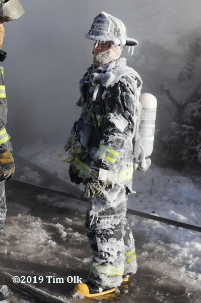 Firefighter encrusted in ice at fire scene