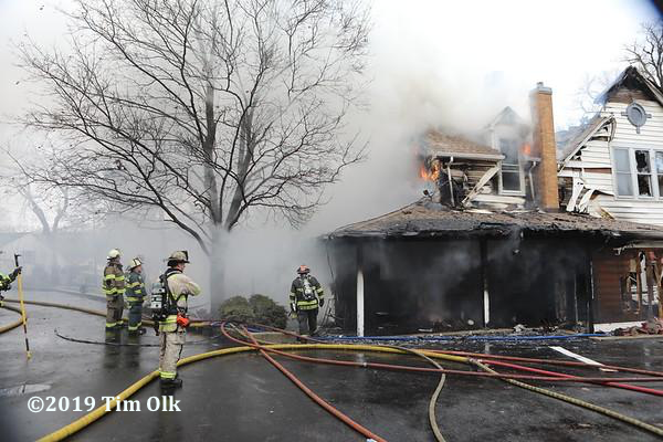 Firefighters battle large house fire