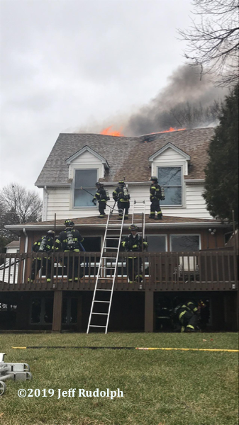 Firefighters battle large house fire