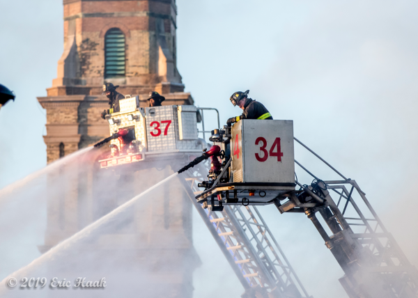 dual Chicago FD tower ladder buckets with master streams