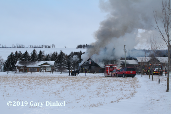 winter house fire scene in Canada