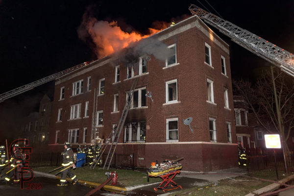 fire in a 3-story apartment building in Chicago at night