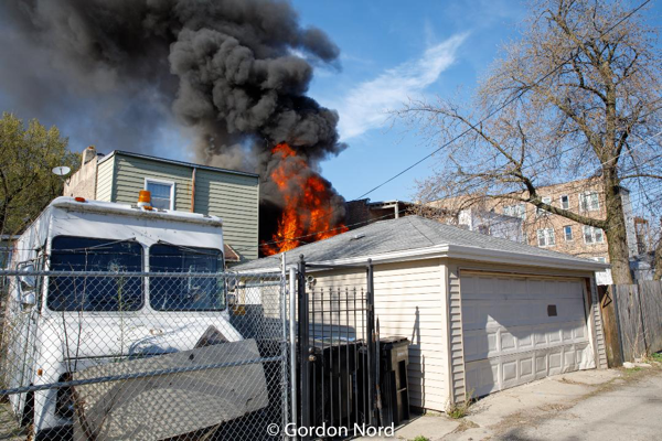 smoke and flames from back porches on fire in Chicago