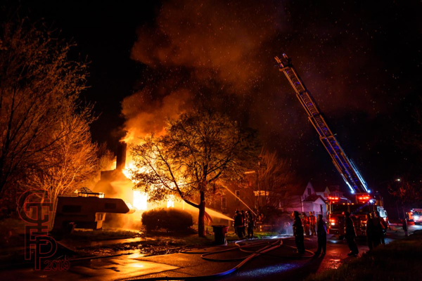 Detroit Firefighters battling fire in a vacant house that was going throughout
