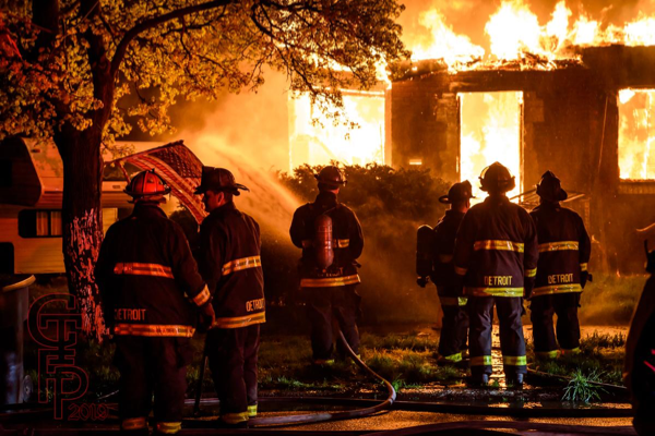 Detroit Firefighters battling fire in a vacant house that was going throughout