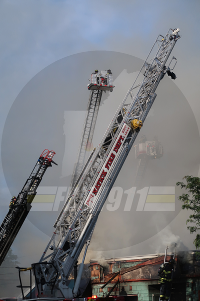 aerial ladders at work at fire scene