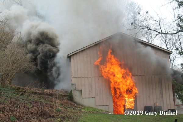 smoke and flames from barn on fire