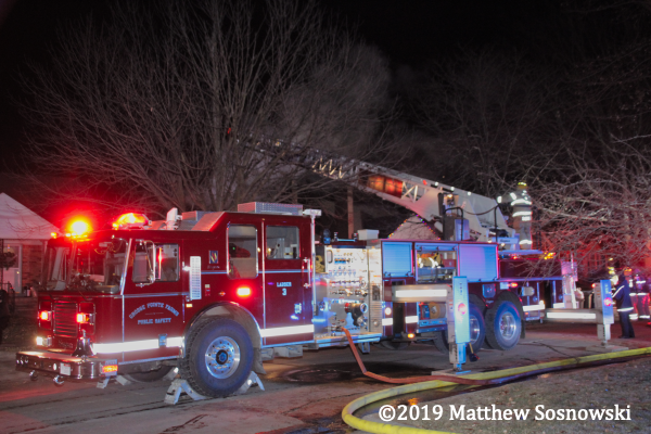 Seagrave ladder truck at fire scene