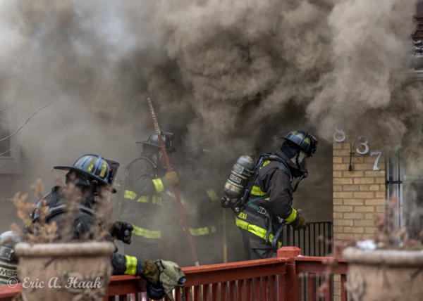 Firefighters enter house with heavy smoke