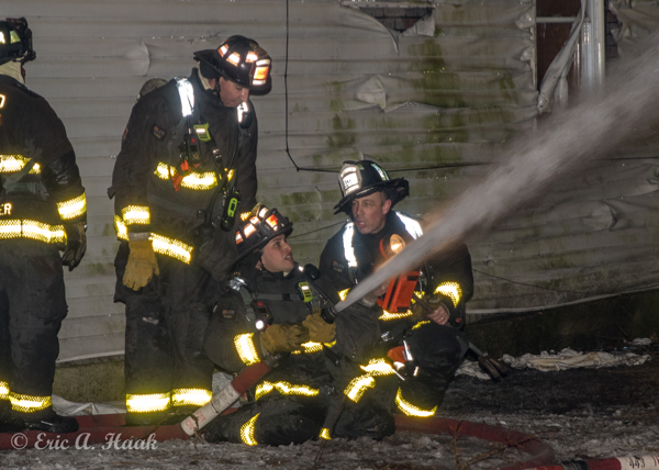 Firefighter mentors candidates at fire scene