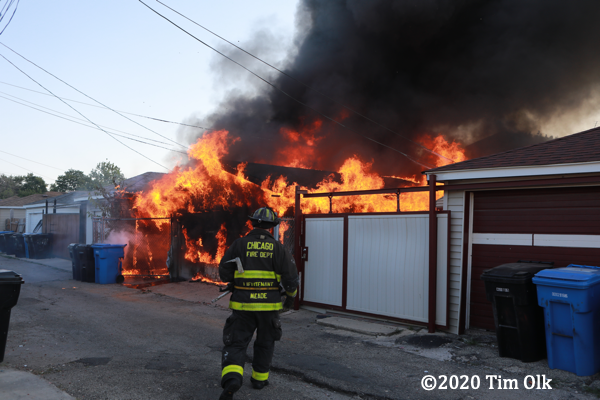 alley garage engulfed by fire