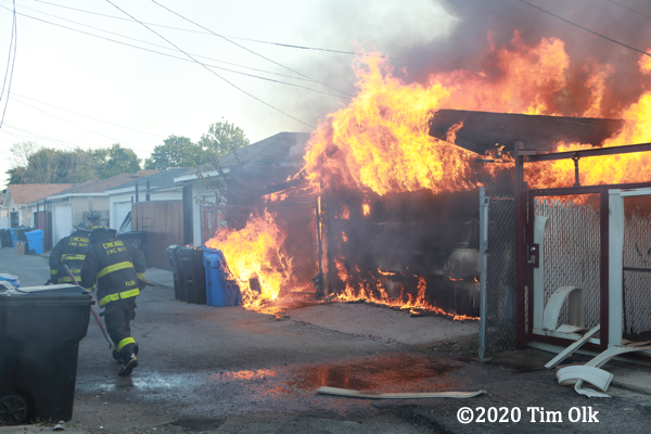 alley garage engulfed by fire