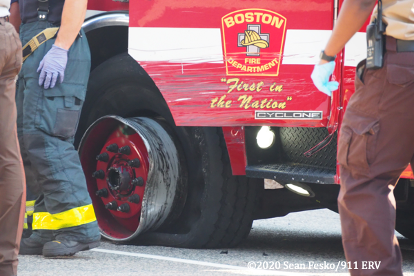 crash scene in Boston involving a fire truck