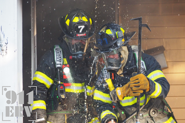 Firefighters in PPE at house fire