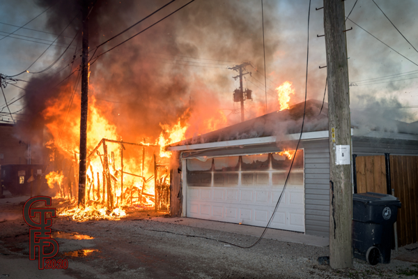 heavy fire from alley garage
