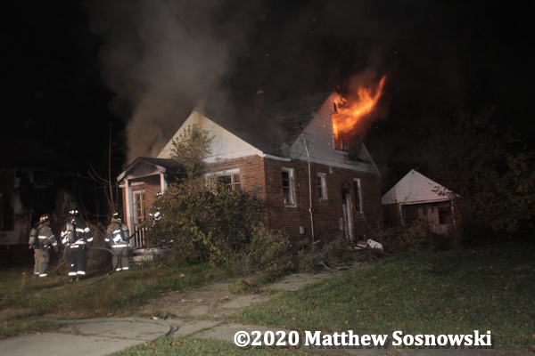 flames from a vacant dwelling in Flint Michigan