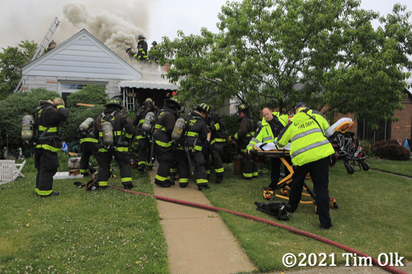 paramedics receive fire victim pulled from a house