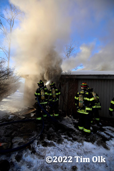 Firefighters at the scene of a house fire in Northbrook, IL